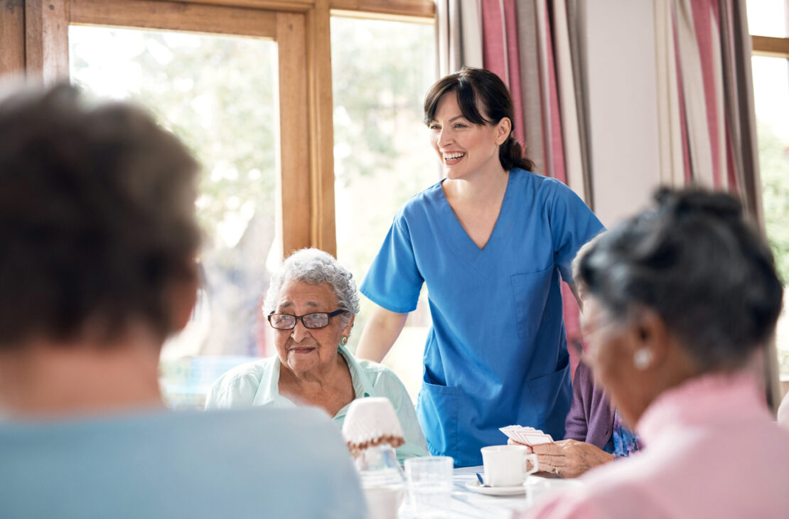 Shot of a group of senior women playing cards together at a retirement home