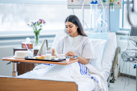 woman eating in hospital