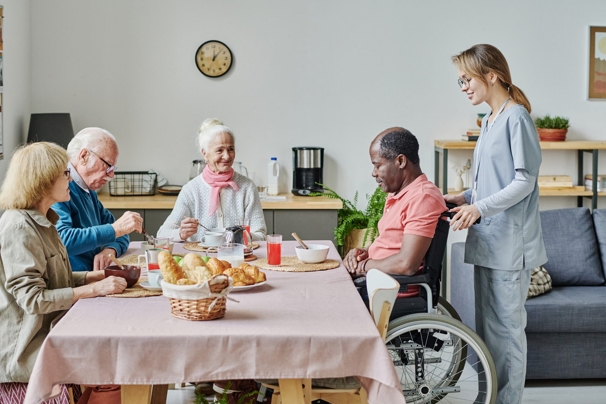 Senior people eating at table